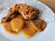 Una foto de pollo con salsa de mandarinas