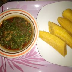 Boiled plantain and green vegetable sauce A picture of Boiled plantain and green vegetable sauce.