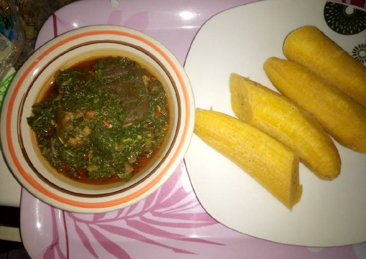 Boiled plantain and green vegetable sauce