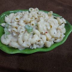 A picture of Pasta with white sauce.