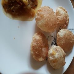 Club kachori with Aloo curry A picture of Club kachori with Aloo curry.