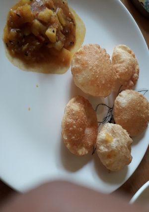 A picture of Club kachori with Aloo curry.
