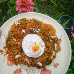 A picture of Vegetable Maggi with Poached Egg.