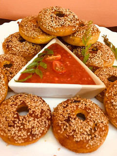 A picture of Instant Doughnut Shaped Handvo (savory Doughnut cake) made of maize flour#bakedsnacks.