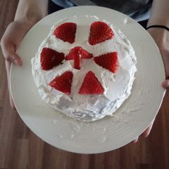 A picture of My 15 year old made chocolate cake with strawberry n whipcream.