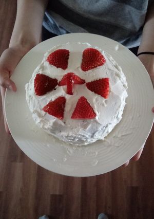 A picture of My 15 year old made chocolate cake with strawberry n whipcream.