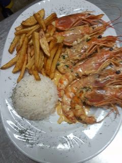 Una foto de Langostinos al whisky 
