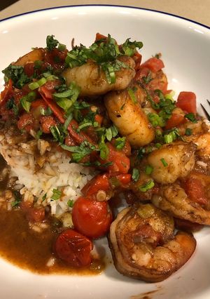 A picture of Spiced Ginger Shrimp with Burst Tomatoes.