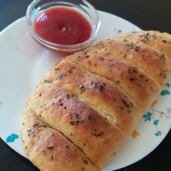 A picture of Domino's style stuffed cheese garlic bread.