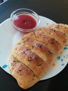 A picture of Domino's style stuffed cheese garlic bread.