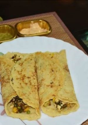 A picture of Moong dal (lentil) and chickpea roll (chila).