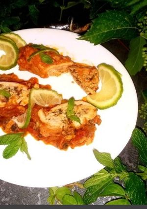 A picture of Rolled chicken breast stuffed with rice and spinach.