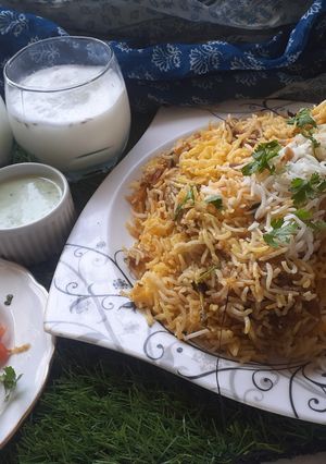 A picture of Chicken dam biryani with namkeen lassi.