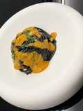 Squid Ink Spaghetti, Shellfish Butter, Sea Urchin Cream, and Gremolata
