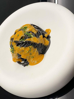 A picture of Squid Ink Spaghetti, Shellfish Butter, Sea Urchin Cream, and Gremolata.