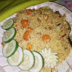 A picture of Stir fry cous-cous with veggies.