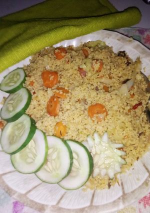 A picture of Stir fry cous-cous with veggies.