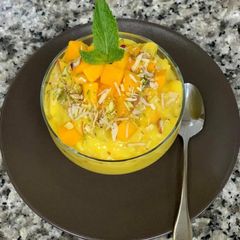 A picture of Golden milk fruit custard with jaggery.