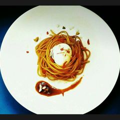 A picture of Boiled Egg in a Spaghetti nest.
