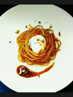 A picture of Boiled Egg in a Spaghetti nest.
