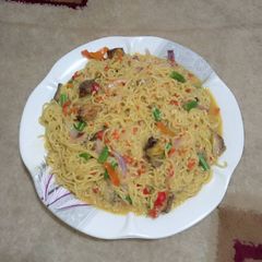 A picture of Indomie jollof with Ice fish.