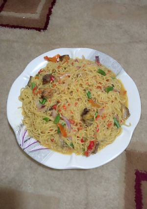 A picture of Indomie jollof with Ice fish.