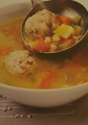 A picture of Slow Cooker vegetable broth with mini bacon dumplings.