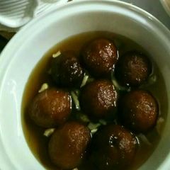 A picture of Bread gulabjamun in leftover sugar syrup....