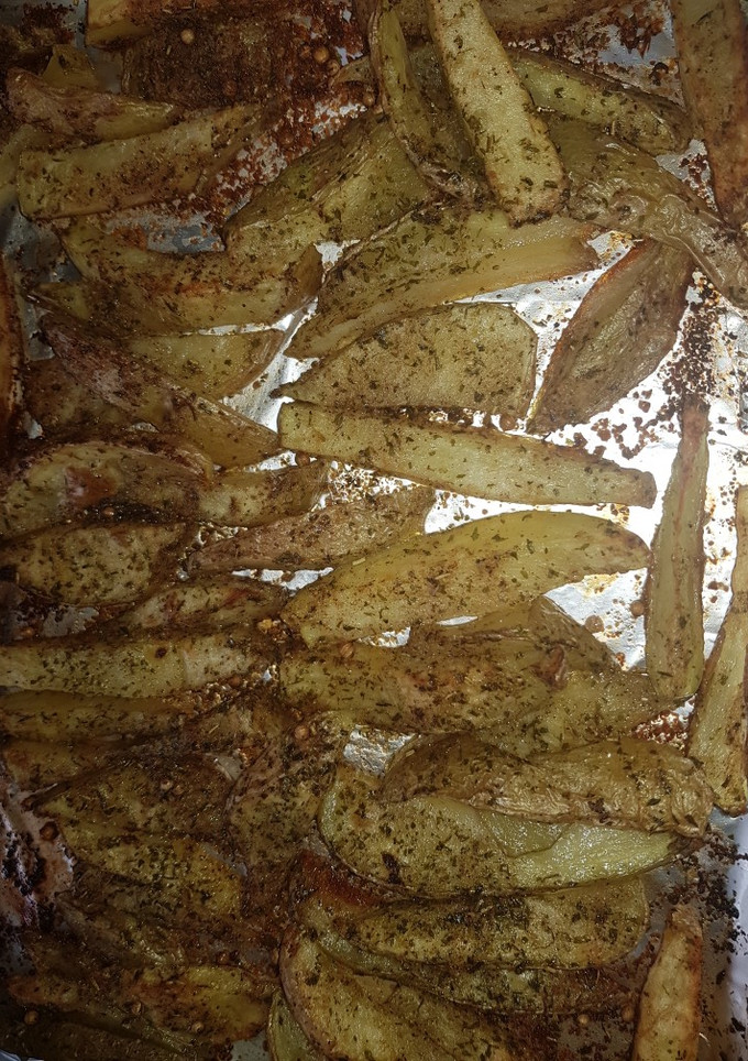 Una foto de Patatas rústicas con salsa de queso