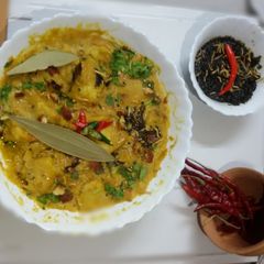 A picture of Dahi moong daal with pitha curry.(moong dal with yogurt recipe).