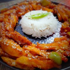 A picture of Schezwan Chilli Potatoes with Jeera Rice.