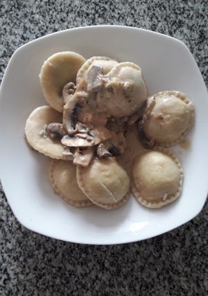 Una foto de Sorrentinos al champignon
