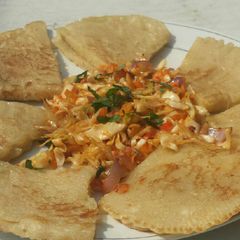Fuffy pancake serve with steamed veggies A picture of Fuffy pancake serve with steamed veggies.