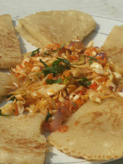 A picture of Fuffy pancake serve with steamed veggies.