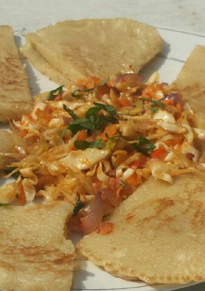 A picture of Fuffy pancake serve with steamed veggies.