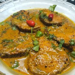 A picture of Rohu Fish in Mustard Gravy.