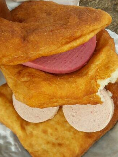 A picture of Fat cake with polony and white liver spread.