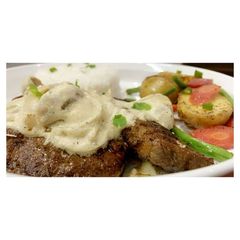A picture of Beef Steak 🥩 with Mushroom Sauce🍄🥣.