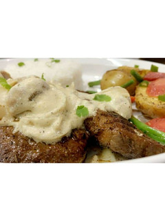 A picture of Beef Steak 🥩 with Mushroom Sauce🍄🥣.