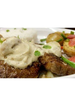 A picture of Beef Steak 🥩 with Mushroom Sauce🍄🥣.