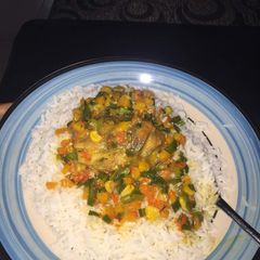 A picture of Curry sauce with boiled rice.