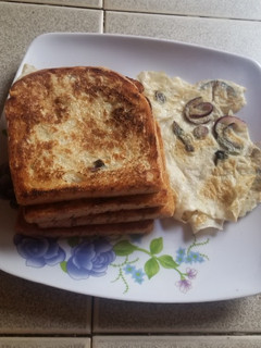 A picture of French toast and fried egg.