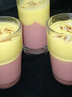 A picture of Mango,strawberry layered lassi.