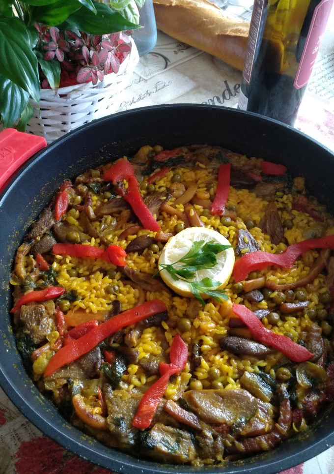 Una foto de Arroz con setas y calamar