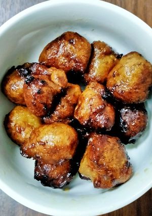 A picture of Banana Fritters in Jaggery Syrup.