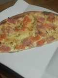 Flammekueche with Tomatoes, Ham, and Raclette