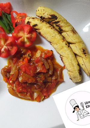 A picture of Roasted plantain with ponmo (kpomo) sauce.