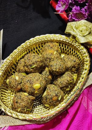 A picture of Wheat flour seeds and nuts Ladoo with leftover ghee residue.