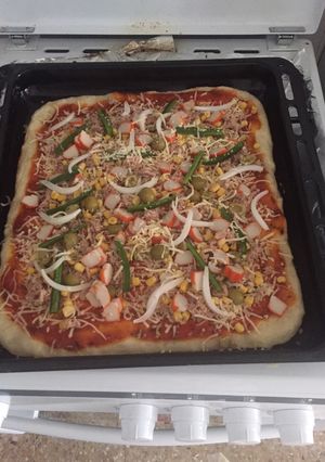 Una foto de Pizza casera y crujiente
