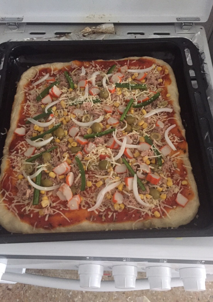 Una foto de Pizza casera y crujiente